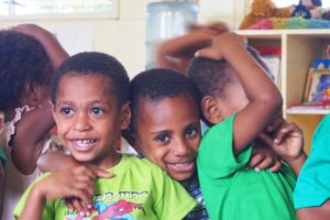 Three young boys at school in Papua New Guinea