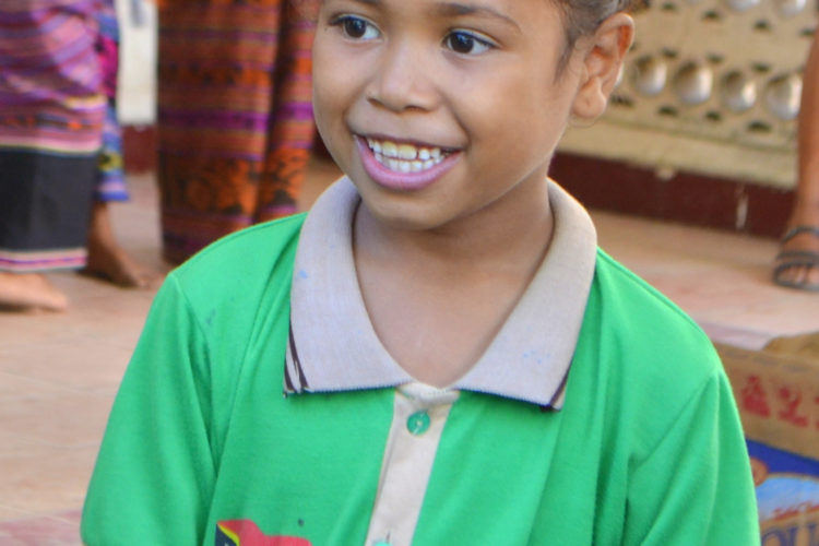 Timorse girl smiling at camera