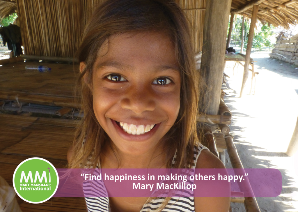 Young Timorese girl smiling looking directly at the camera