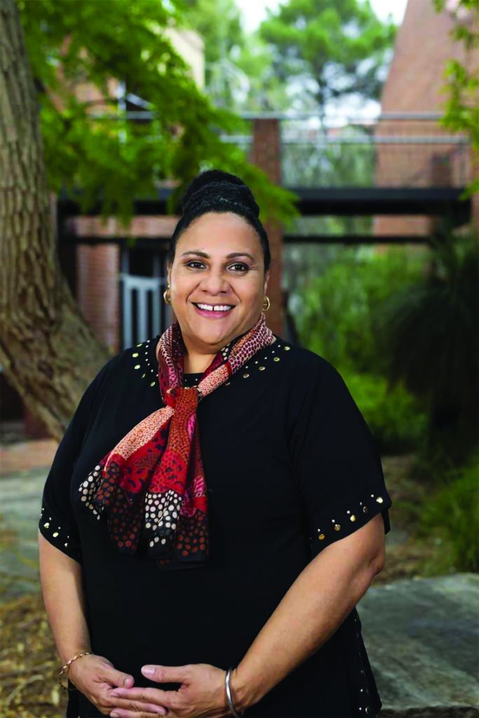 Linda, a Mary MacKillop Today Scholarship recipient facing the camera outside on university campus.